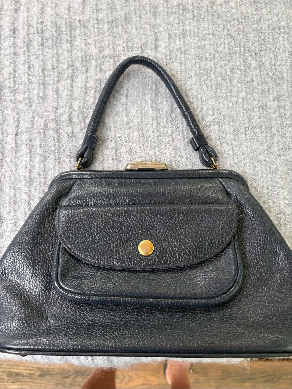 Elegant Black Leather Bag with Front Pocket